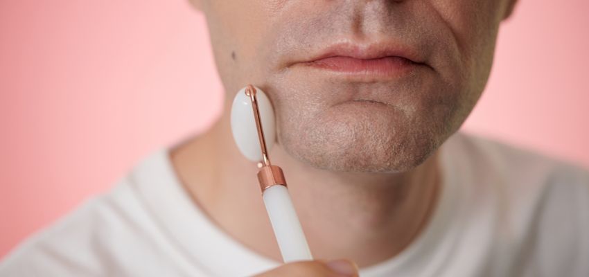 The man massaged his face to get rid of jowls.