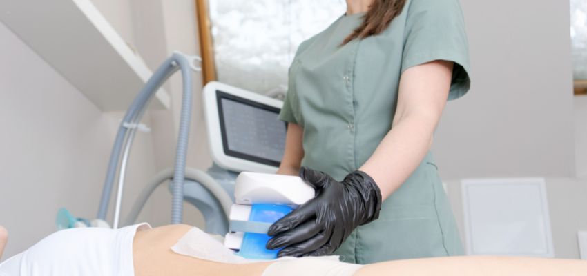 CoolSculpting procedure being performed on the abdominal area.