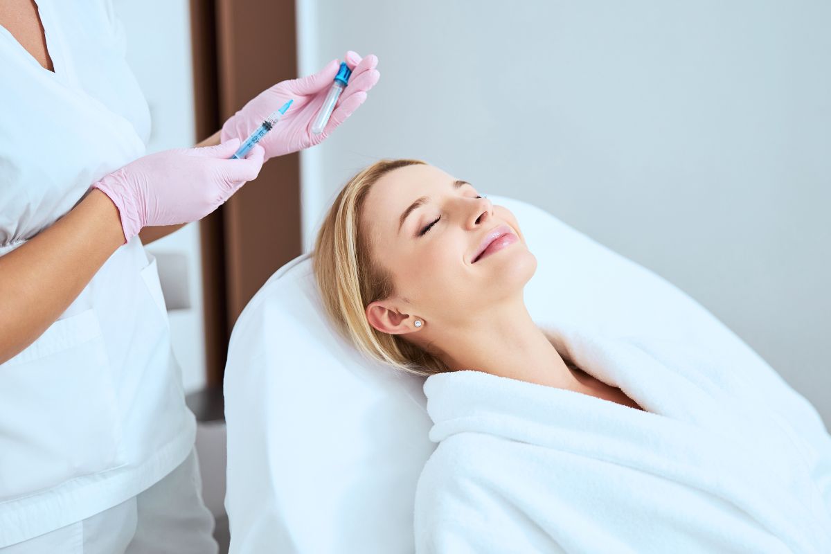 Woman receiving platelet rich fibrin (PRF) treatment for skin rejuvenation.