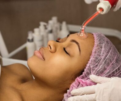 The woman undergoes a high-frequency facial.